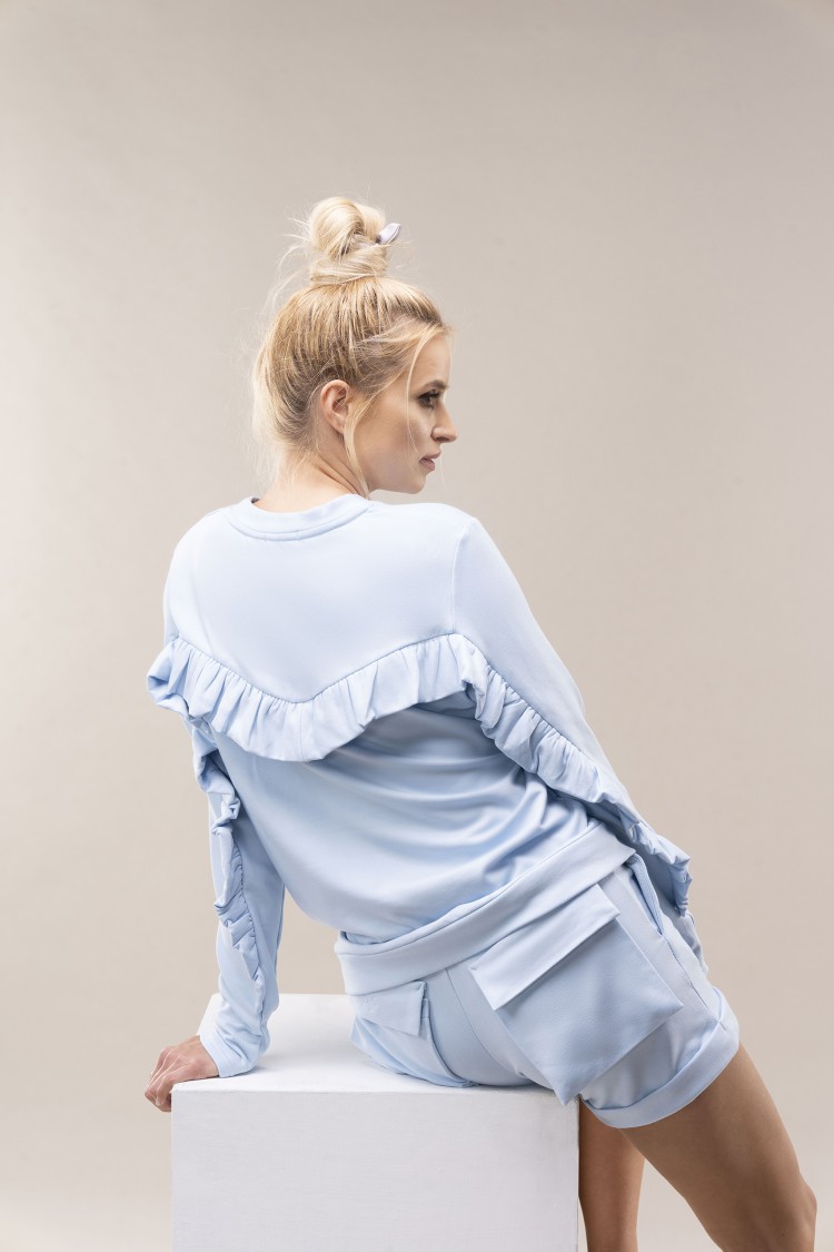 Bluzka z falbanką baby blue